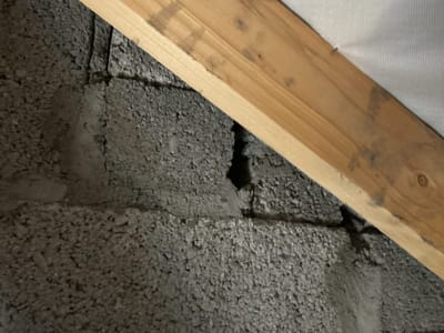 Gap left in the firewall between two adjoining units, seen from the attic