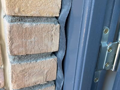 Gap between the door frame and the brickwork — Front door