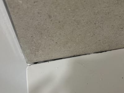 Plaster edge chipped at the reveal — Landing