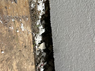 Wall insulation left open at the base — External wall
